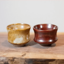 Two burned mud cups.
