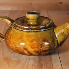 Brown clay tea pot.