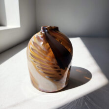Brown and white clay vase.