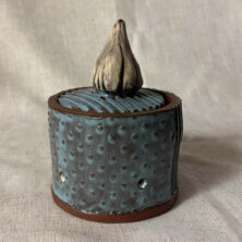 Blue and white clay garlic jar.